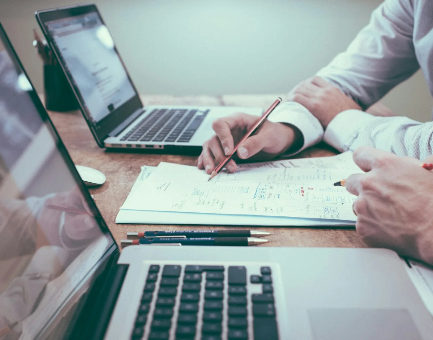 Consultants reviewing a business plan and data
